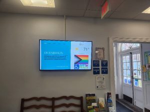 TV screen hanging up in church office lobby